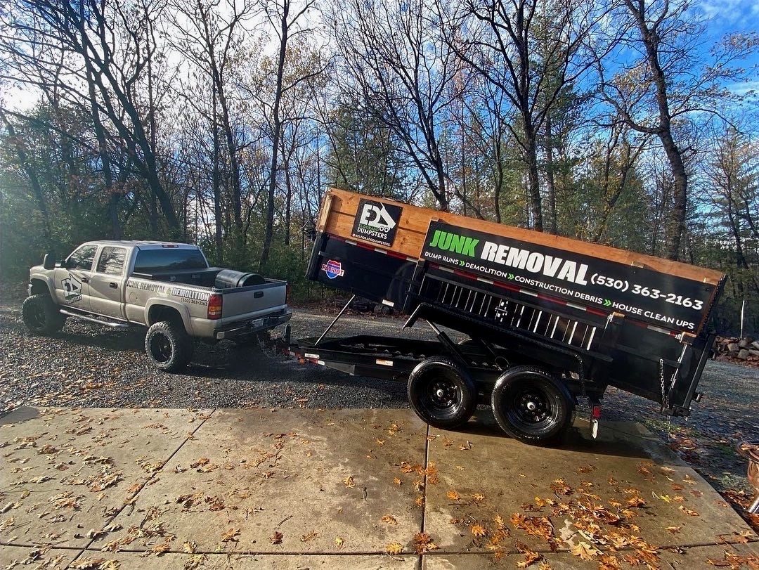 El Dorado Dumpsters truck and branded dump trailer parked on a residential driveway